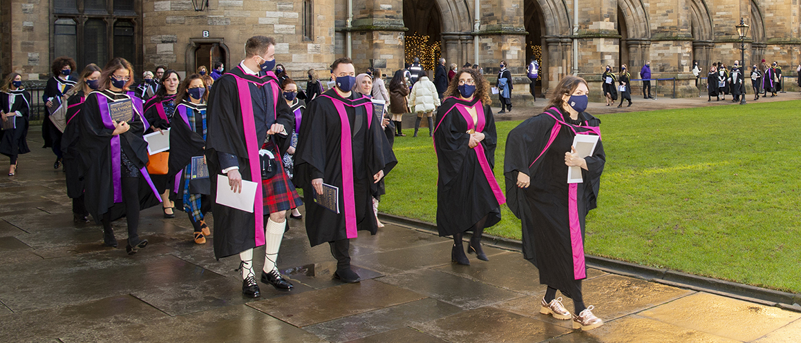 Graduates walking round the quad