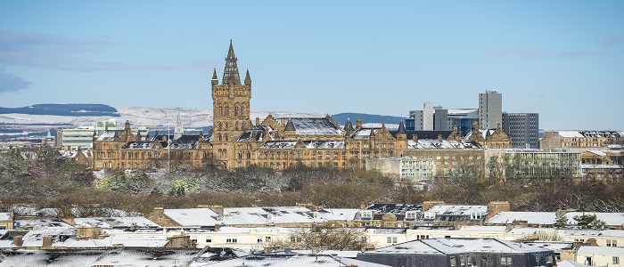 University Main Building, city skyline, snow on hills in the background 