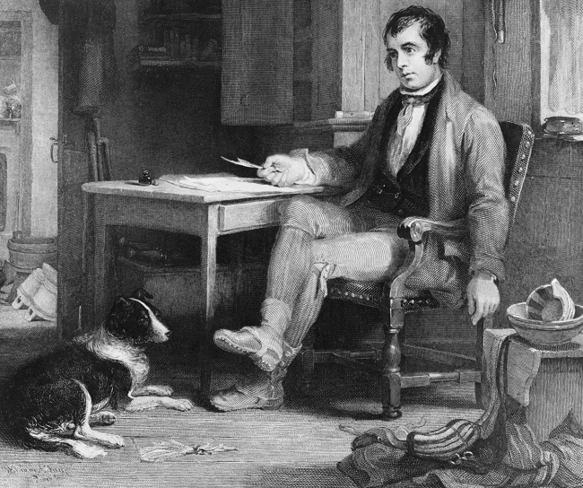 Robert Burns sitting a his desk with a quill in his hand. 