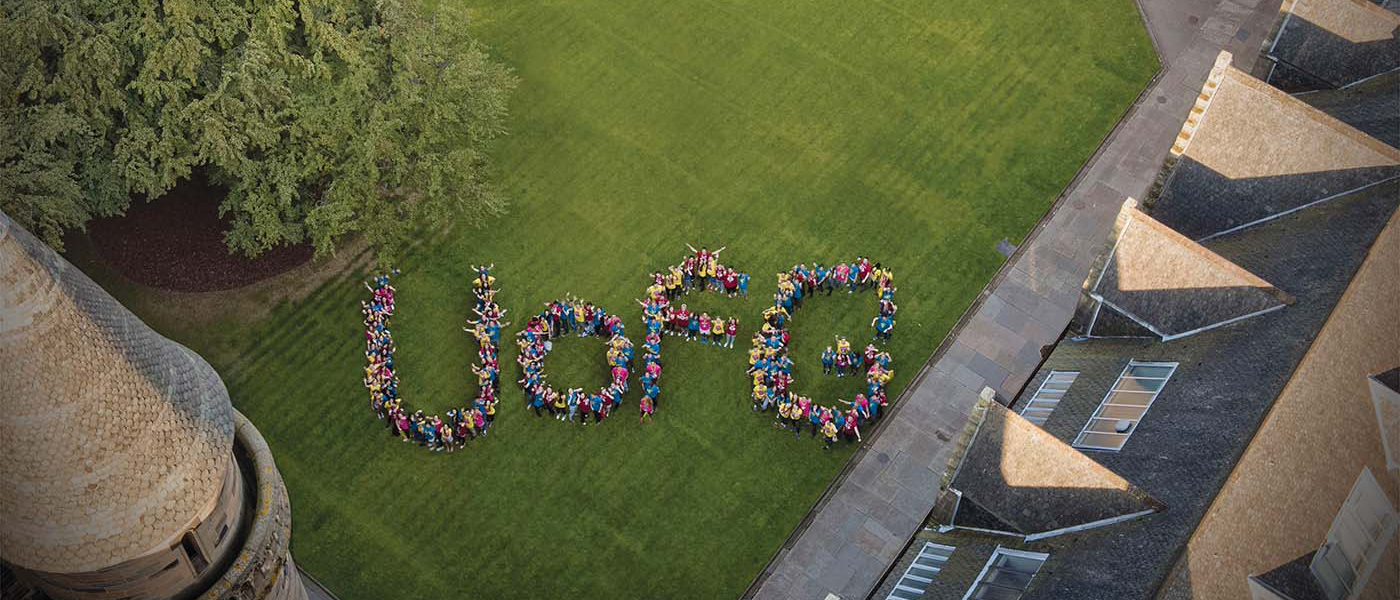 Photo of University of Glasgow quadrangle from above with large lettering U of G