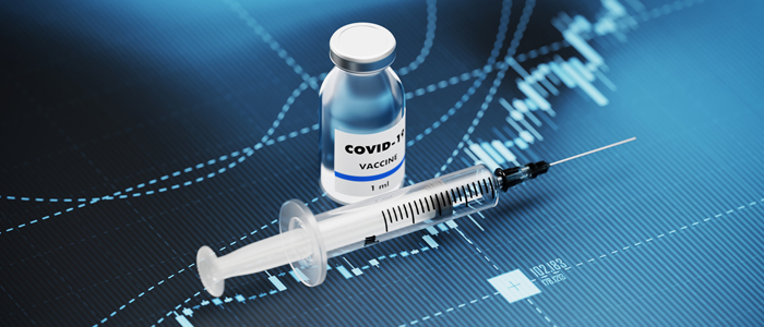 Photo of a bottle of covid vaccine and syringe