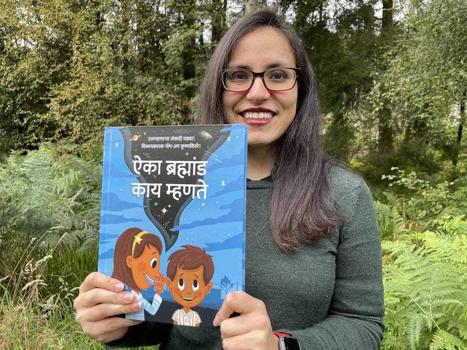 Mariela holding a book