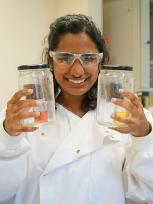 Edwina - student in lab holding beakers