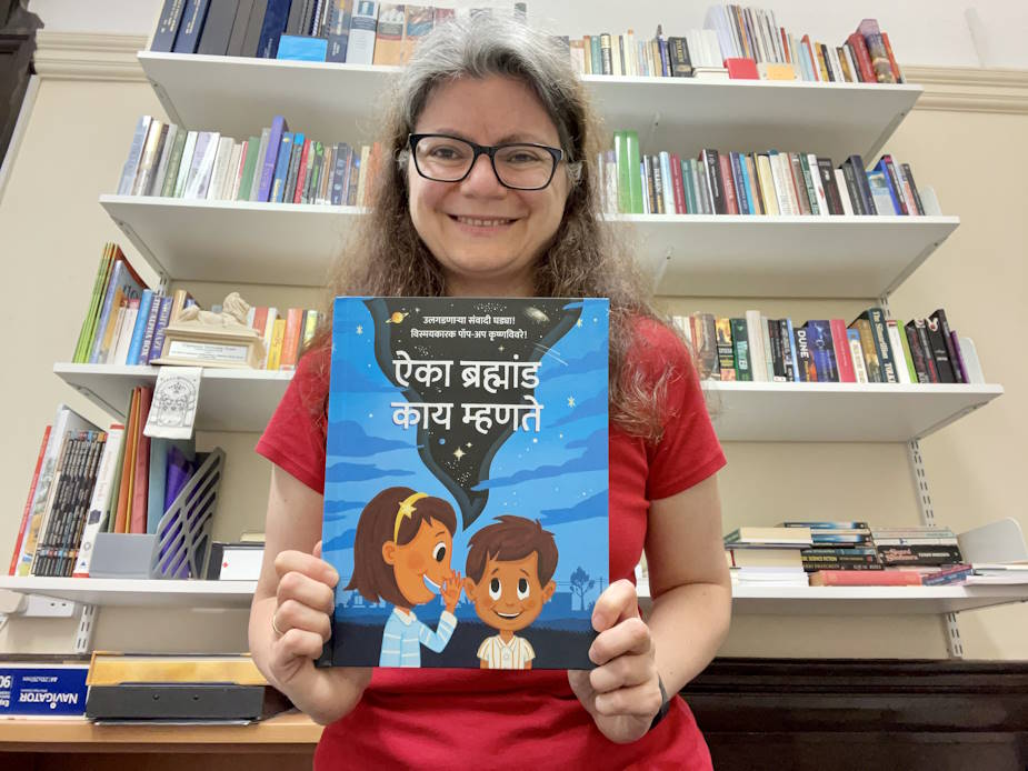 Dimitra holding a book