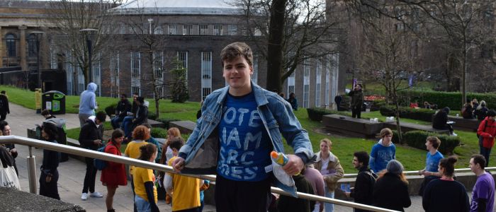 Liam from SRC standing on Library Hill 