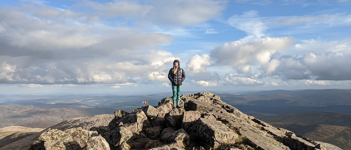 Hazel standing on Mountain Top