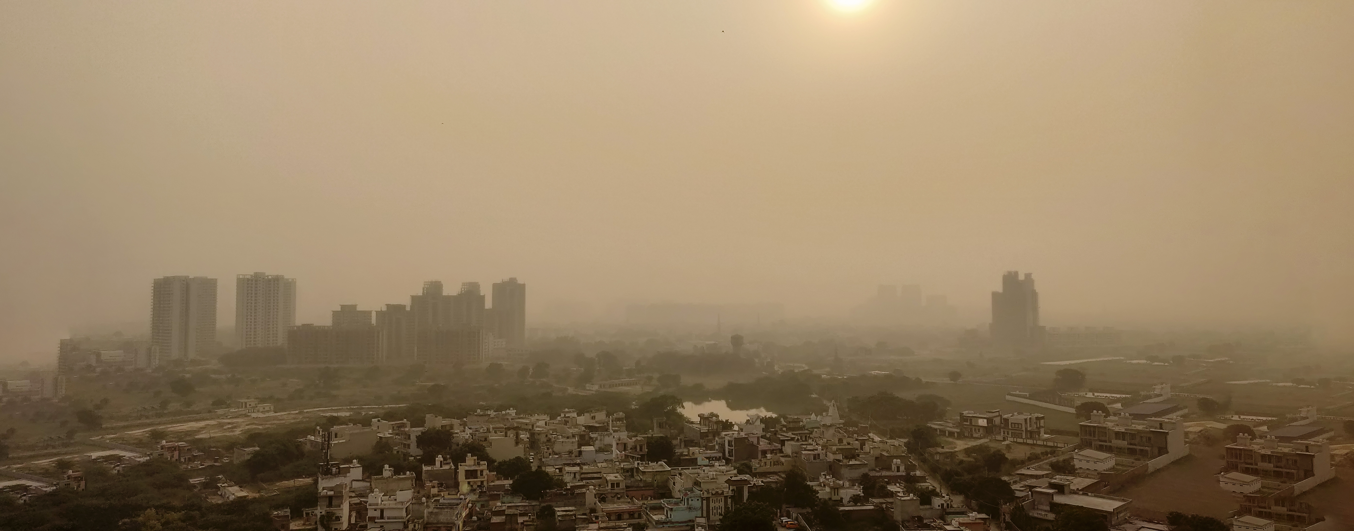 View over houses and apartment tower blocks in Delhi, India, with yellowish hazy air due to smog and pollution. Image credit: abhisheklegit | iStockphoto https://www.istockphoto.com/photo/delhi-air-pollution-gm1126605395-296668246