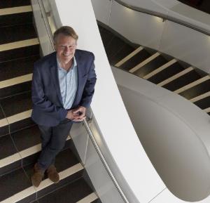 Prof Stephen J Simpson photographed on the stairs at the Charles Perkins Centre