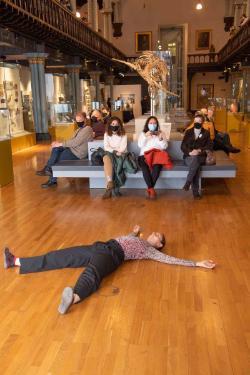 Student lying on the floor of the Hunterian