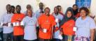 Group photo of project workshop participants in red and grey project t-shirts