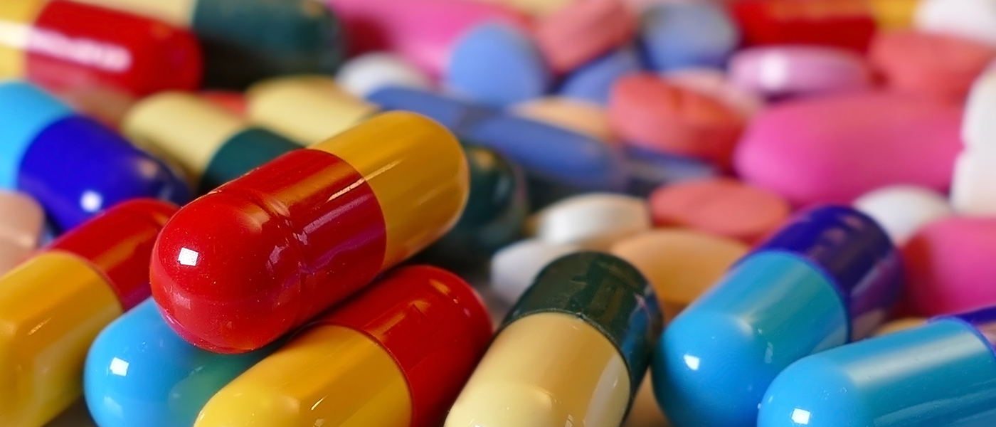 Photo of brightly coloured pills and tablets