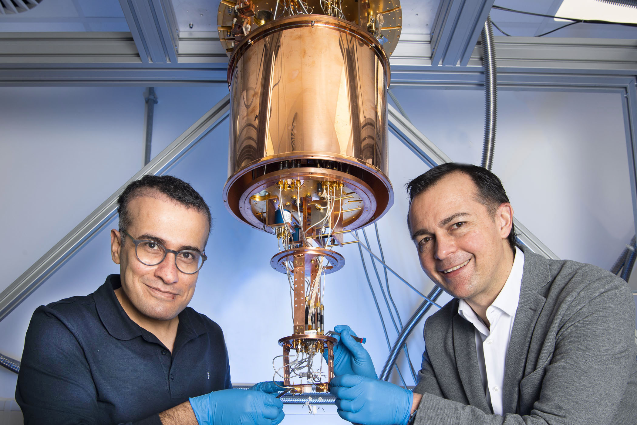 Dr Hadi Heidari (left) and Professor Martin Weides (right) of the University of Glasgow’s James Watt School of Engineering work on some of their quantum computing equipment.