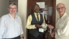 Prof Garside watches on as Prof Waters presents Dr Chrispinus Mumena with a UofG quaich (Zambia, March 2022)