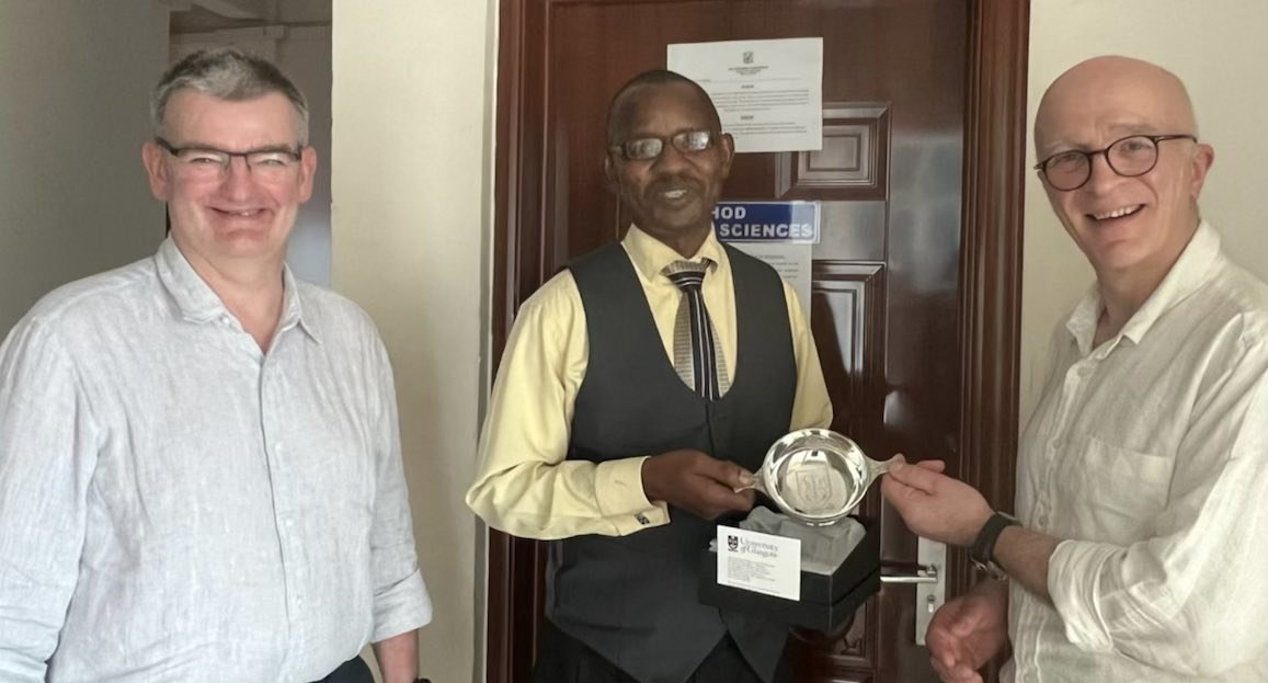 Prof Garside watches on as Prof Waters presents Dr Chrispinus Mumena with a UofG quaich (Zambia, March 2022)