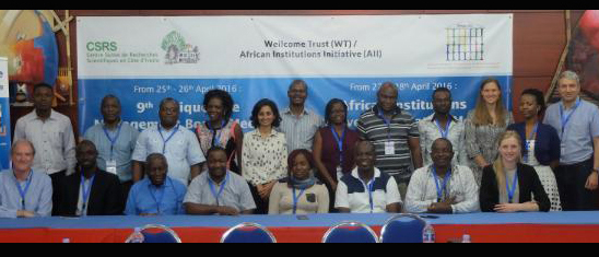 Group photo of people in front of an Afrique One banner