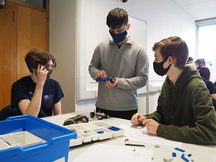 Image of Craig Best helping students from Year 1 product design engineering lab.