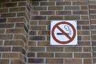No smoking sign on a brick wall