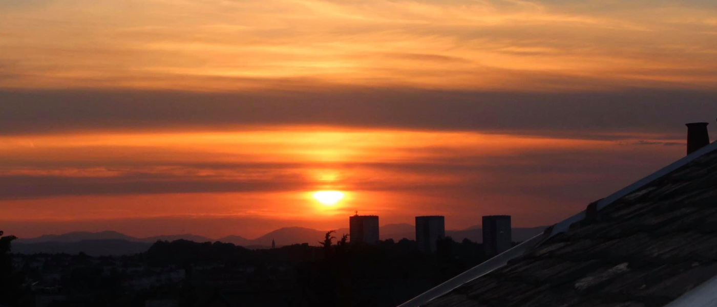 Photo of sunset over Glasgow city rooftops
