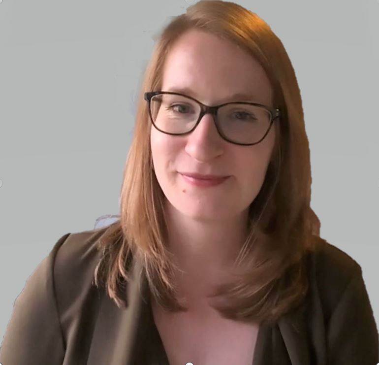 Photo of a young woman in glasses