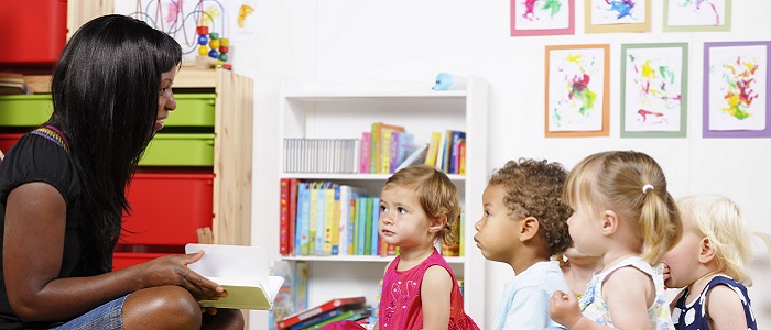 Photo of teacher with young children