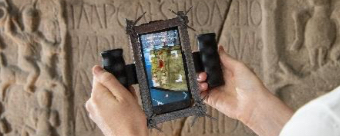 Image of story telling on iPad of Roman carved stone