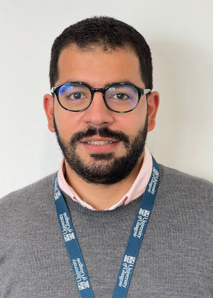 Headshot of Dr Ahmad Taha wearing a grey sweater