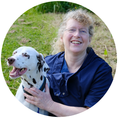 Dr Ingebord Lindholm, vet, holding a Dalmatian