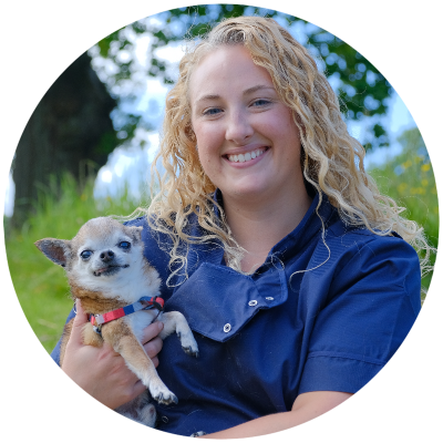 Dr Lindsay Wright, vet, holding a small doggy