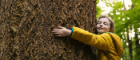 A child hugging a tree