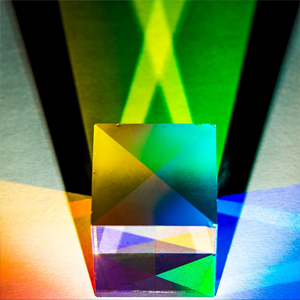 Coloured light shining through a cube