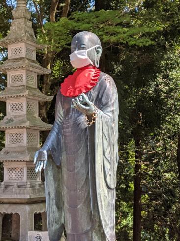 A statue in Mount Hiei in Kyoto wearing a mask