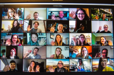A screenshot of a Zoom call with participants waving