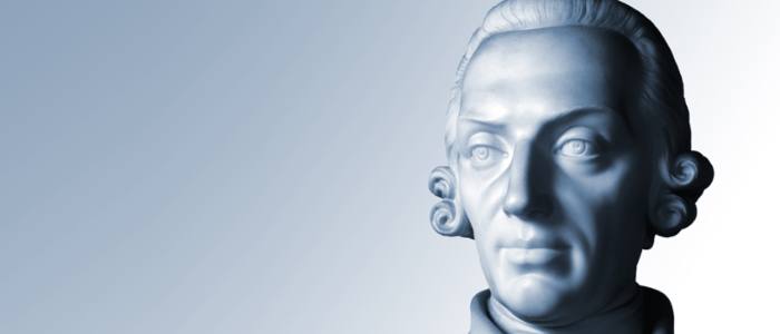Face of Adam Smith statue with a blue tint