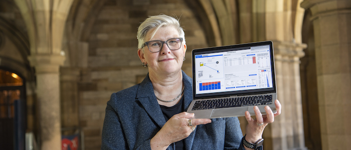 Dr Simone Stumpf with a laptop showing a prototype of the Effi project in action
