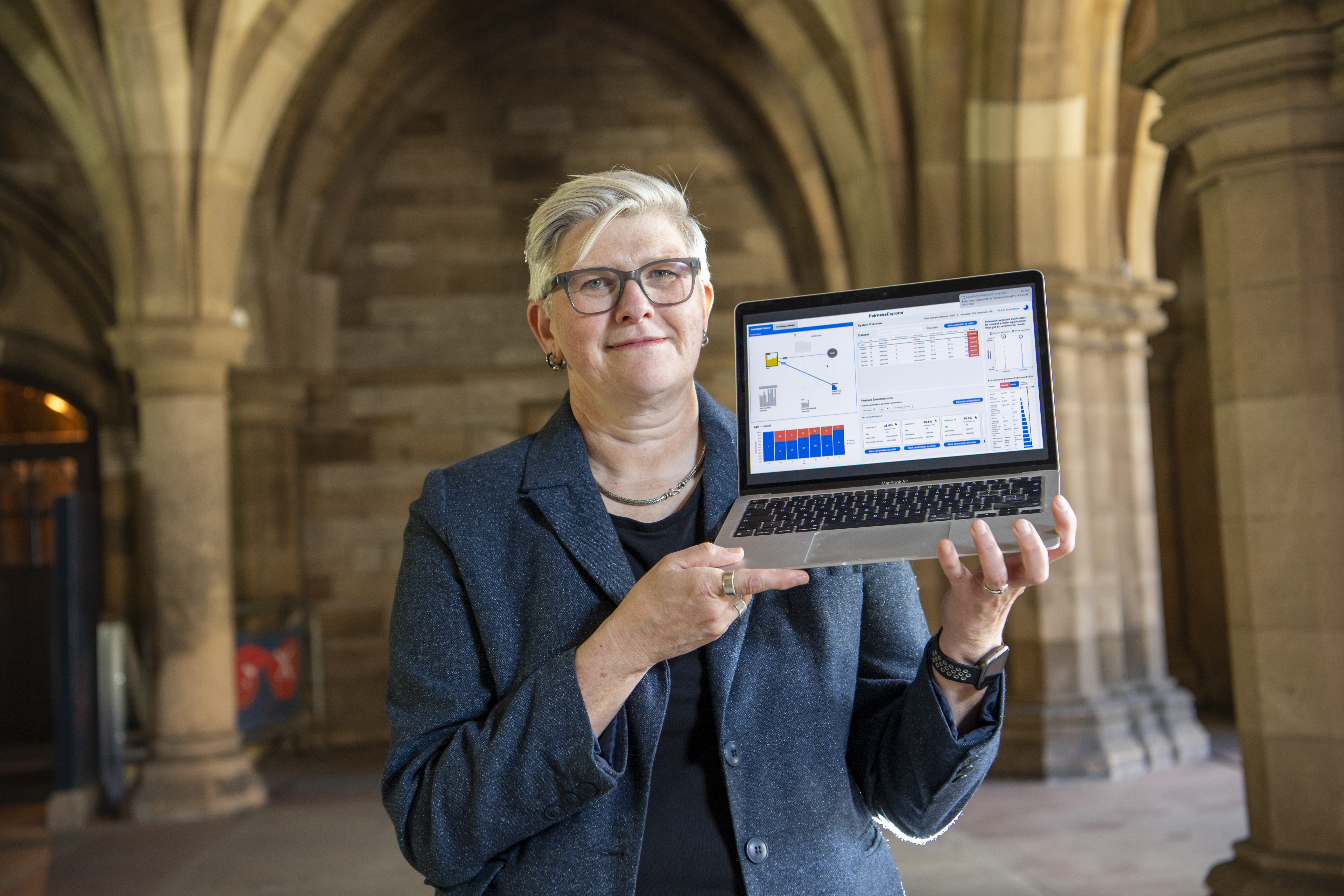 Dr Simone Stumpf with a laptop displaying a prototype of the Effi project