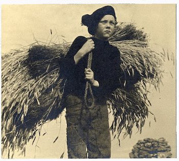 Girl carrying wheat