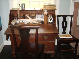 The Desk at Ellisland Farm, home to Robert Burns from 1788-1791, on which are some Burns artefacts.