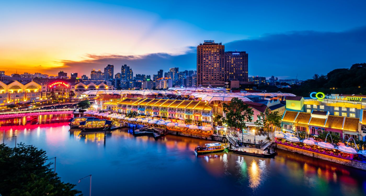 The buildings along Clarke Quay lit up at night [Photo: Shutterstock]