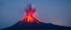 A photograph of an erupting volcano