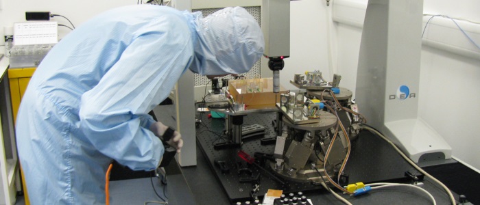 A researcher controlling a hexapod for precision six-axis movement in the LISA cleanroom.