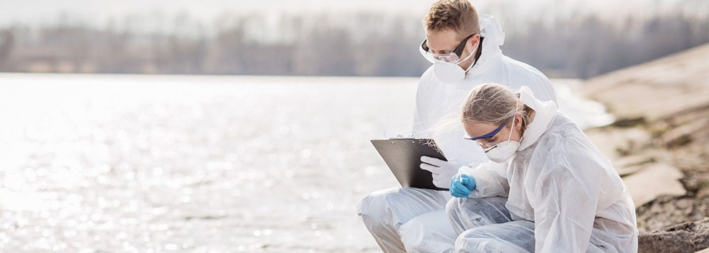 Scientists taking samples of water