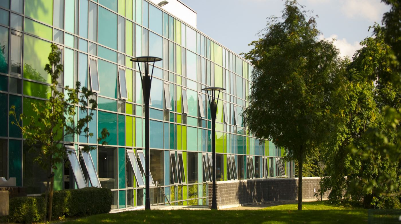 front of the Fraser Building on a sunny day