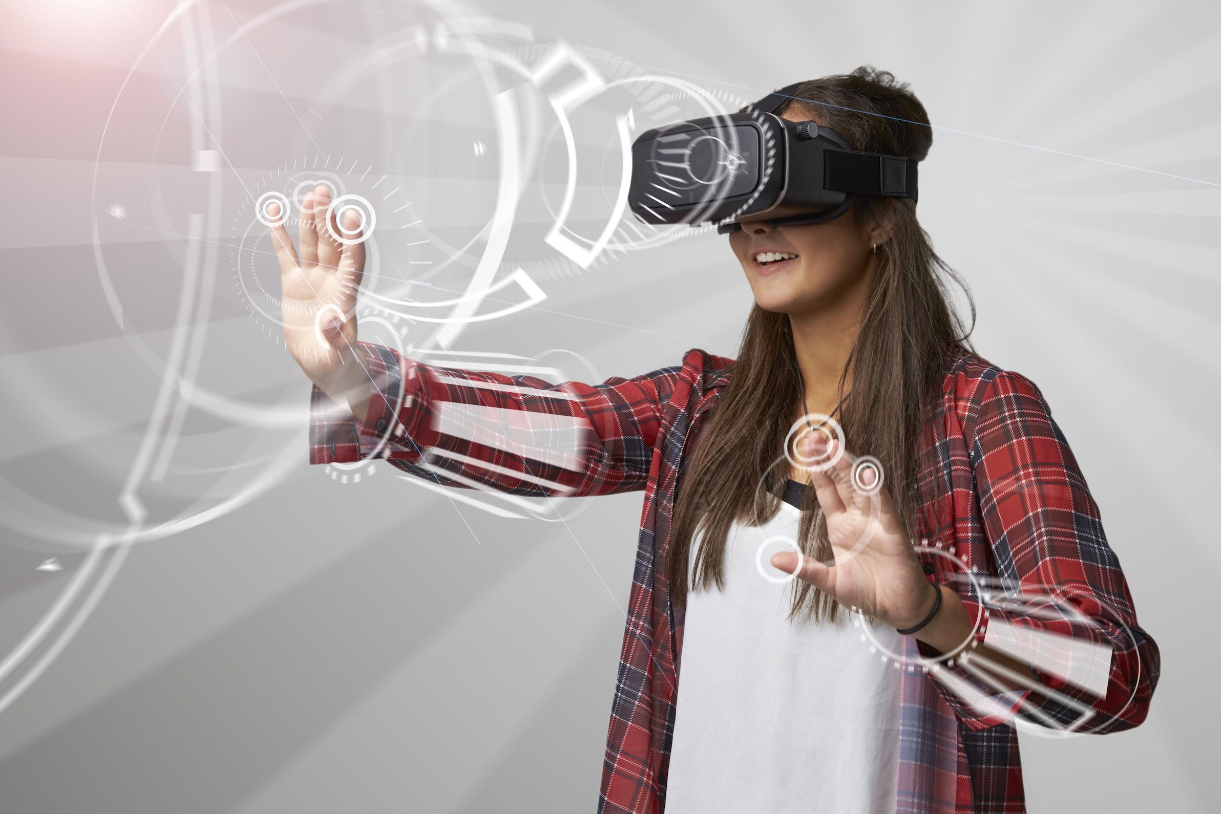 A young woman wears a virtual reality headset