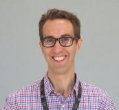 Dr Peter MacPherson dark hair man wearing glasses
