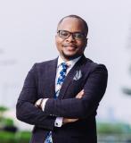 Black man in suit wearing glasses
