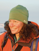 A head and shoulders photograph of Dr Karen Cameron wearing winter clothes in a tundra setting