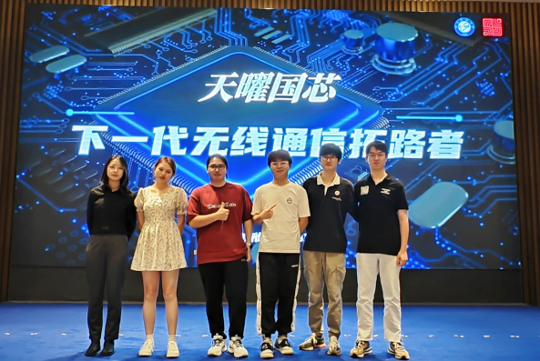 Group of students standing on stage after their prize win