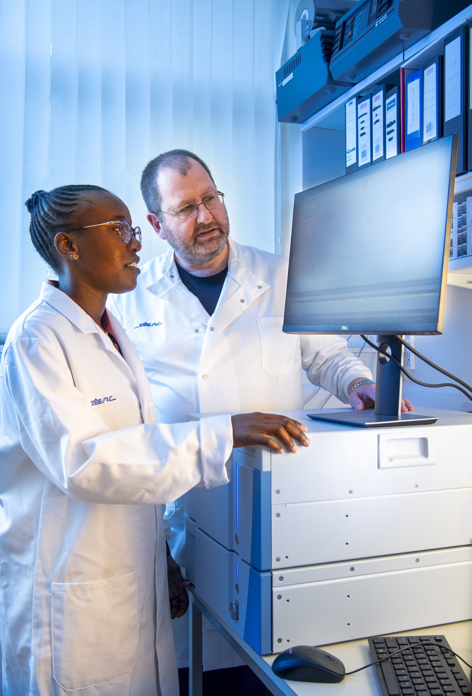 Dr Douglas Morrison, of SUERC and the University of Glasgow, with Ms Kanekwa Zyambo, of the University of Zambia’s Tropical Gastroenterology and Nutrition Group, on-site at SUERC in East Kilbride