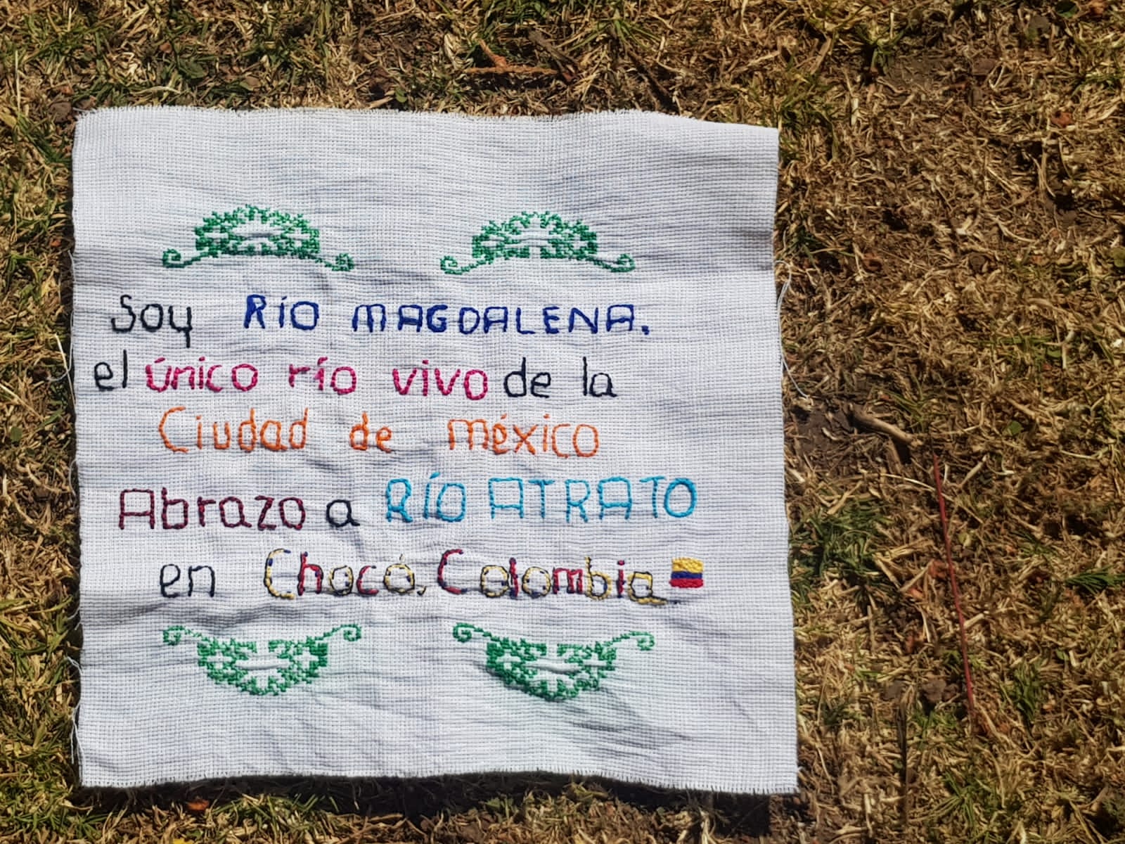 Crotched message on fabric on gravel beach