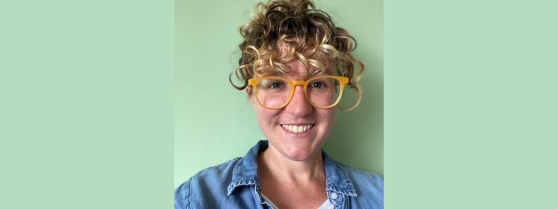 A smiling research fellow